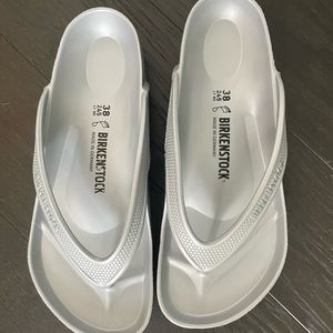Grey Birkenstock flip flops